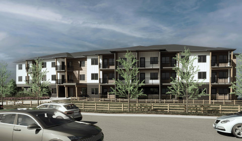 Rendering of an apartment building constructed on a hill, viewed from the parking lot on the high side, with three storeys visible.