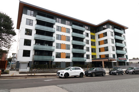 Exterior of The Eleanor, a modern six-storey building located at 125 East 20th Street in Central Lonsdale.