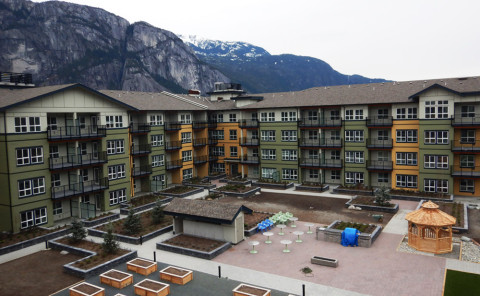 Exterior of The Westwinds seniors housing development, a modern five-storey building located at 38275 Third Avenue in Squamish.