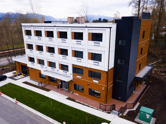Four-storey brown and white building.