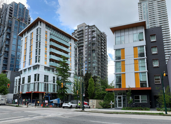 Modern, bright 10-storey building at 1280 Seymour Street. Beside it, a similarly designed but smaller five-storey building at 1302 Seymour Street.