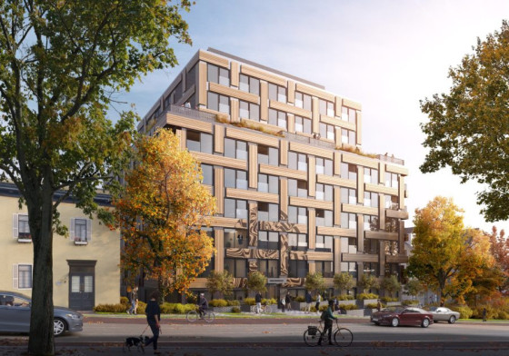 Rendering of a brown low rise building 
