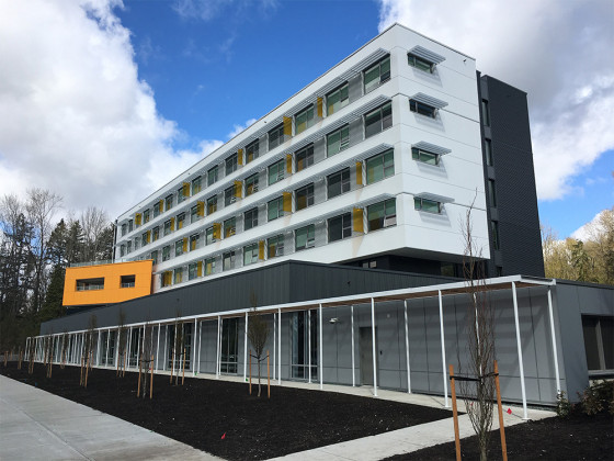 Exterior of Foxglove Drive, a modern six-storey building located at 9810 Foxglove Drive.