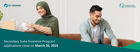 A smiling couple unpacking boxes and decorating their home, promoting the BC Housing Secondary Suite Incentive Program with an application deadline of March 30, 2025.