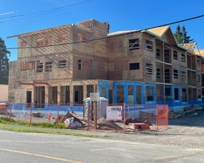 Wooden three story building under construction