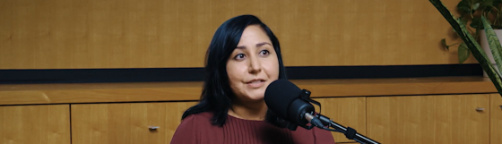 Sairoz Sekhon the director of women's transition housing and supports program at bc housing sitting infront of a microphone