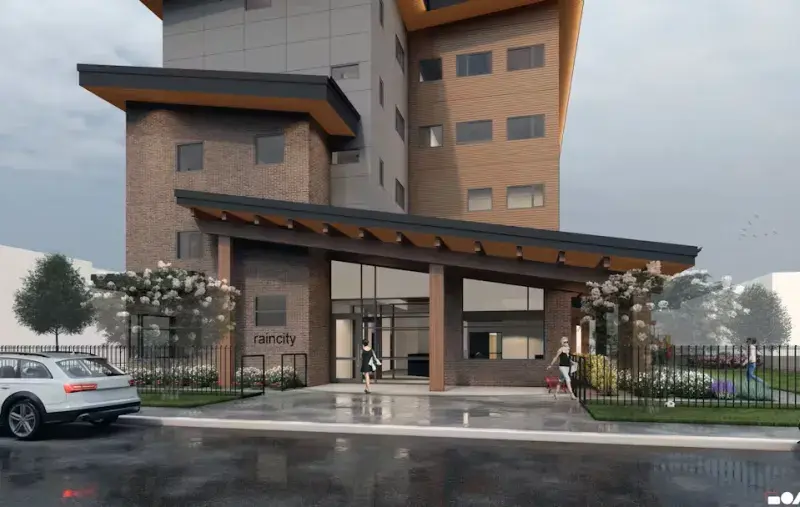 Drawing of a mult-storey modern apartment building. Entrance view with a covered walkway, trees, and a sidewalk along the street.