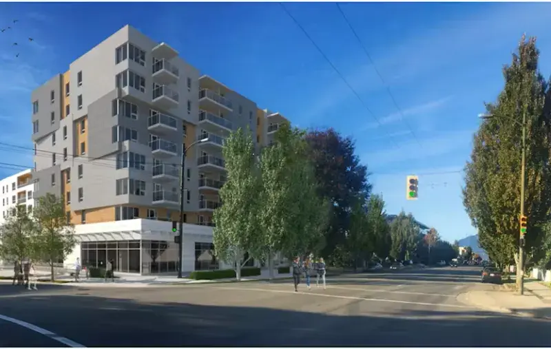 A drawing of a new multi-storey apartment building. On a corner lot with trees on a sunny day with blue sky.