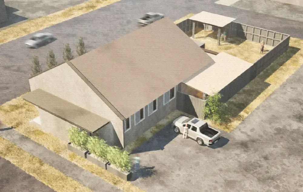 Aerial rendering of a small building with fenced yard, pickup truck parked outside, and nearby road with passing cars.